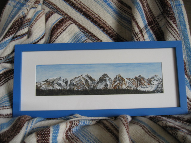 Painting of Seven Sisters Mountains and woven blanket